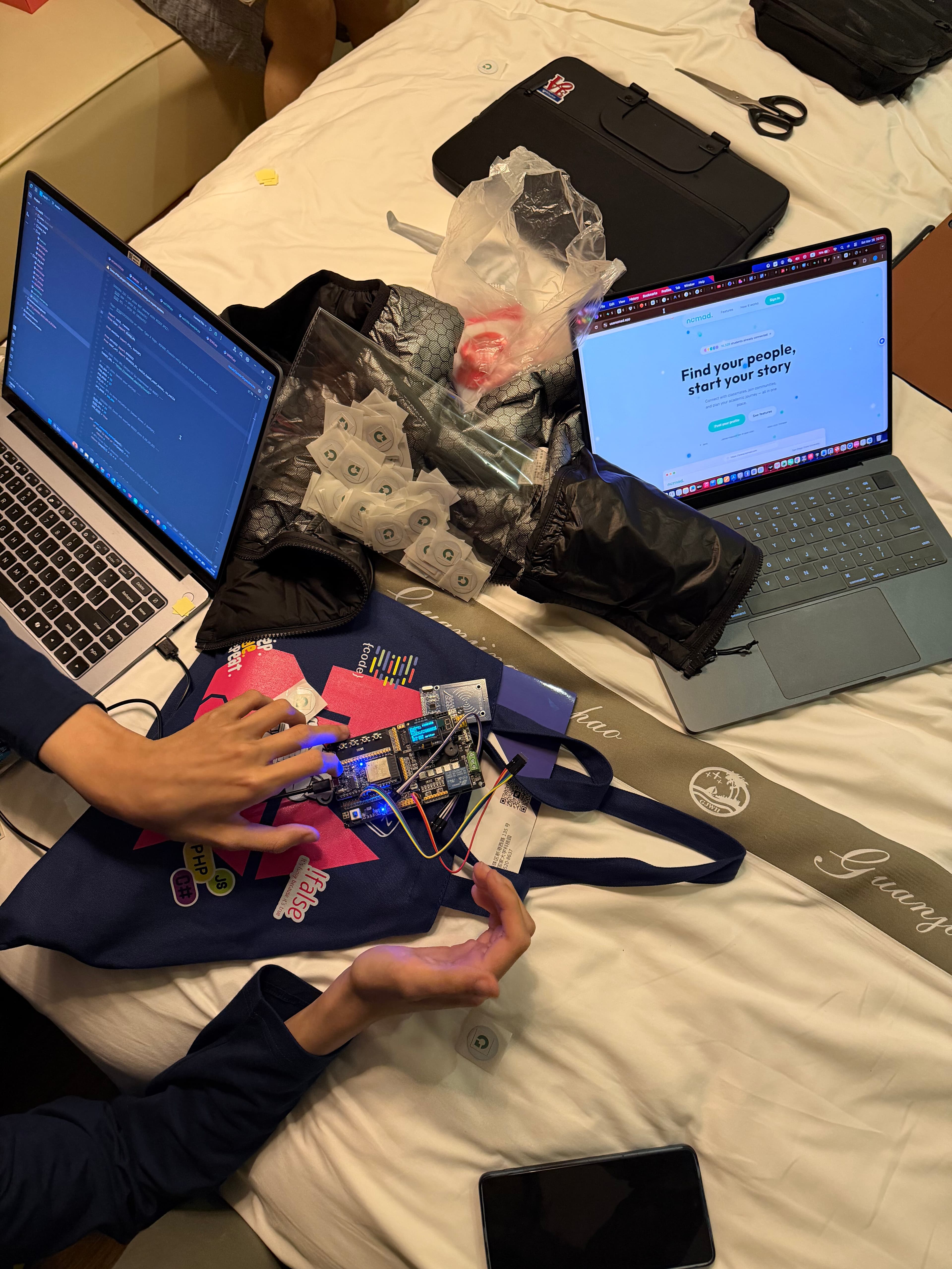 Laptops and hardware on the HackMIT China workspace